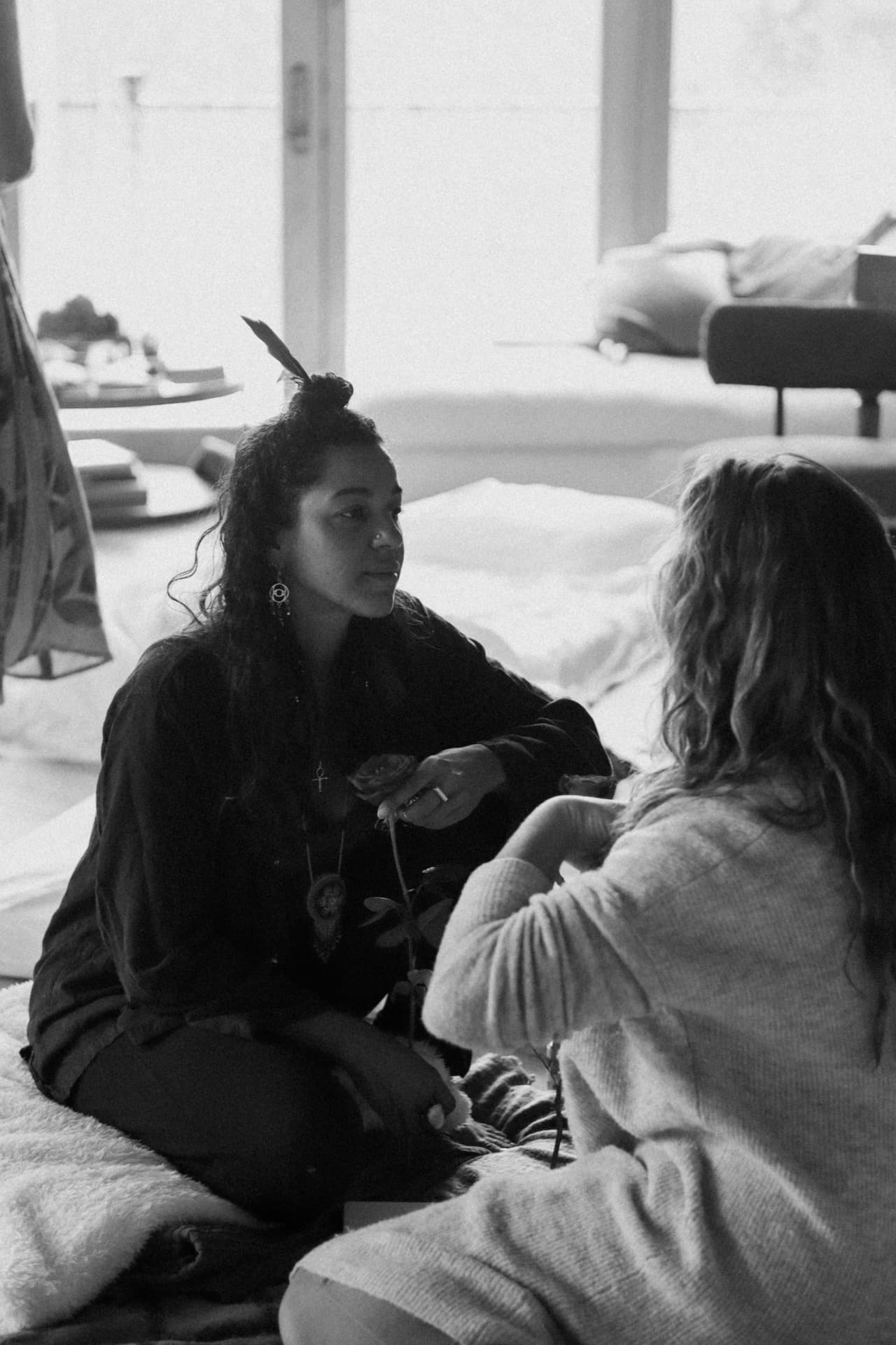 Facilitator sitting with a participant during a one-on-one integration session